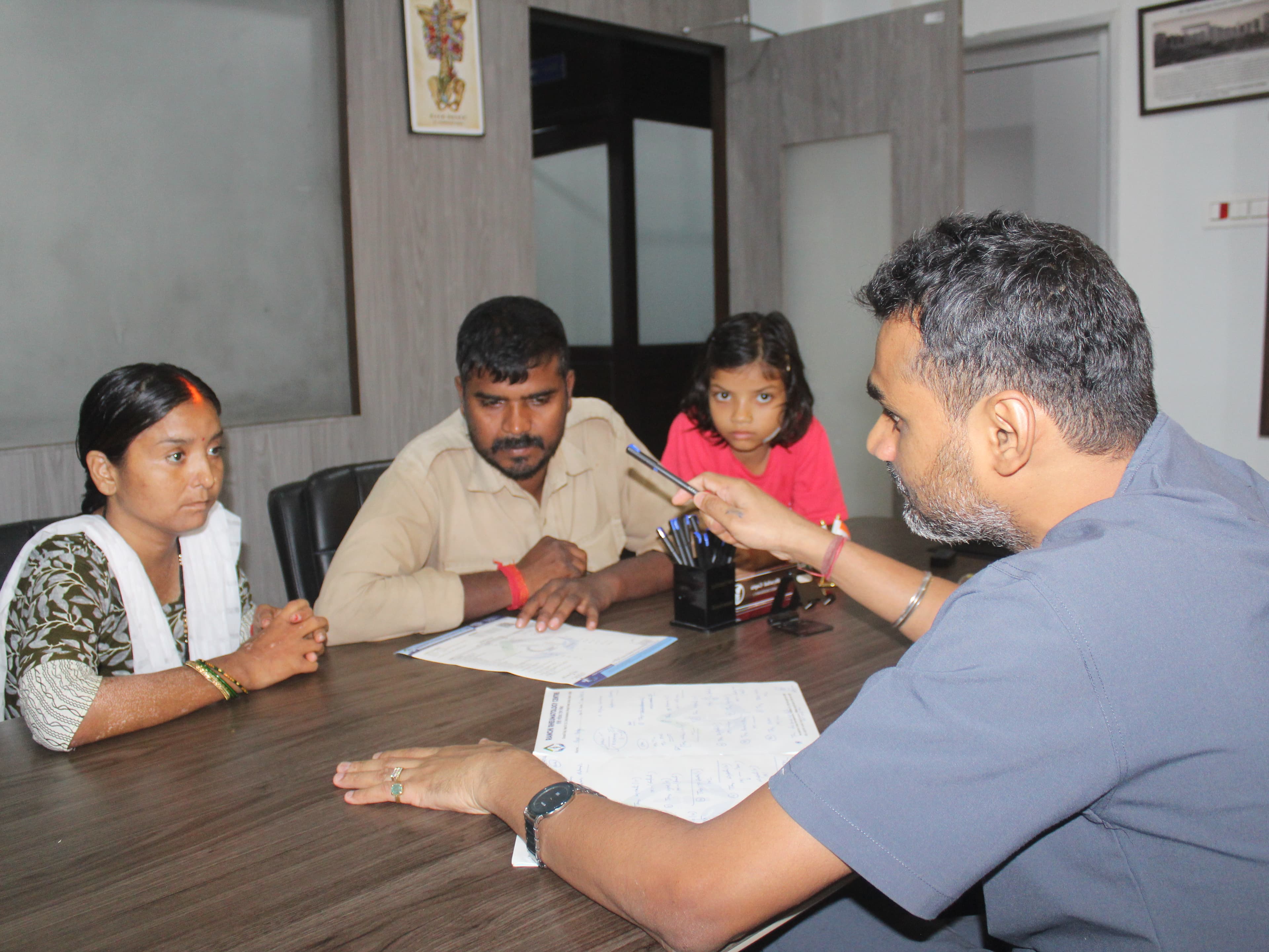 Dr. Gupta consulting with patient and discussing treatment options
